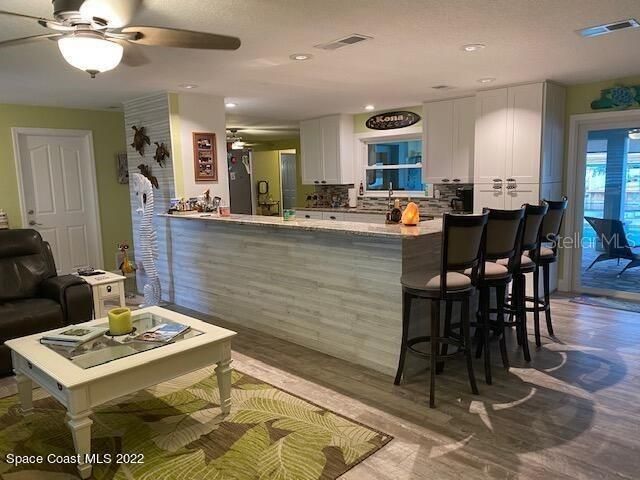 Kitchen Overlooking Bright Living Spaces!