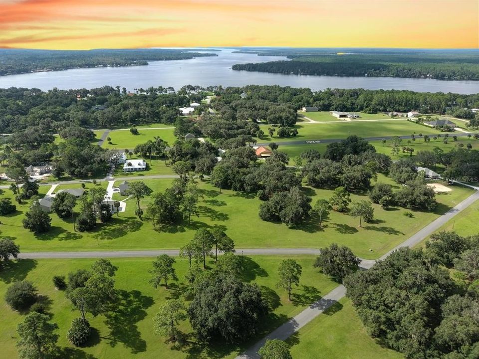 View of 385 Lindsay Ln on bottom, Runway in middle; St. Johns River on top