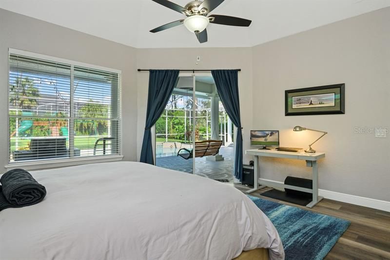 Master Bedroom with sliding glass door access to Patio and Pool