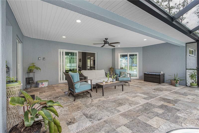 Plenty of room to entertain on this covered lanai with terrazzo flooring