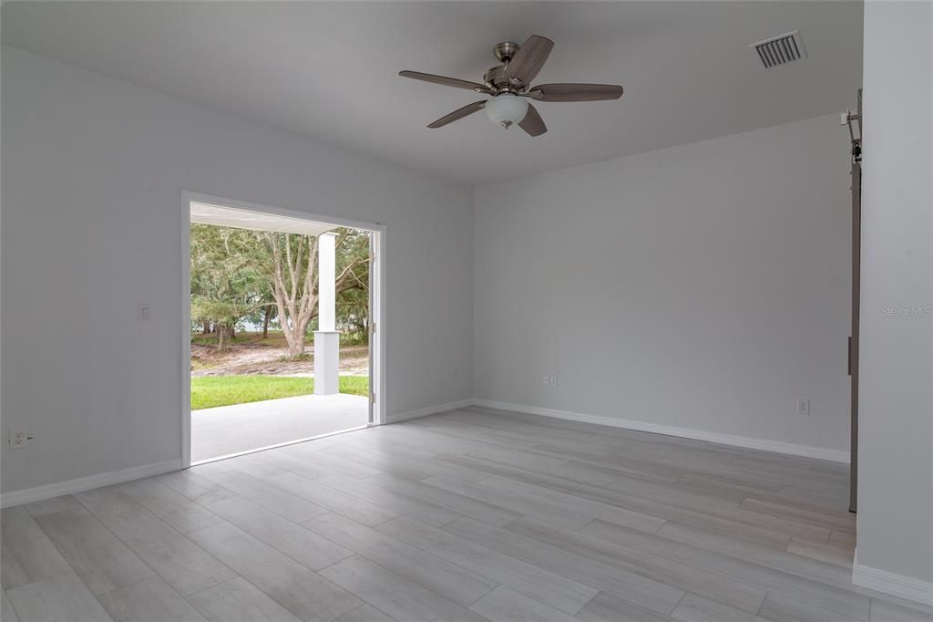 Primary Bedroom facing French Doors to back patio