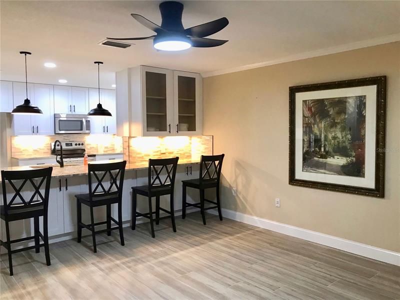 Spacious living-dining-kitchen combo with a walkout to large screened patio