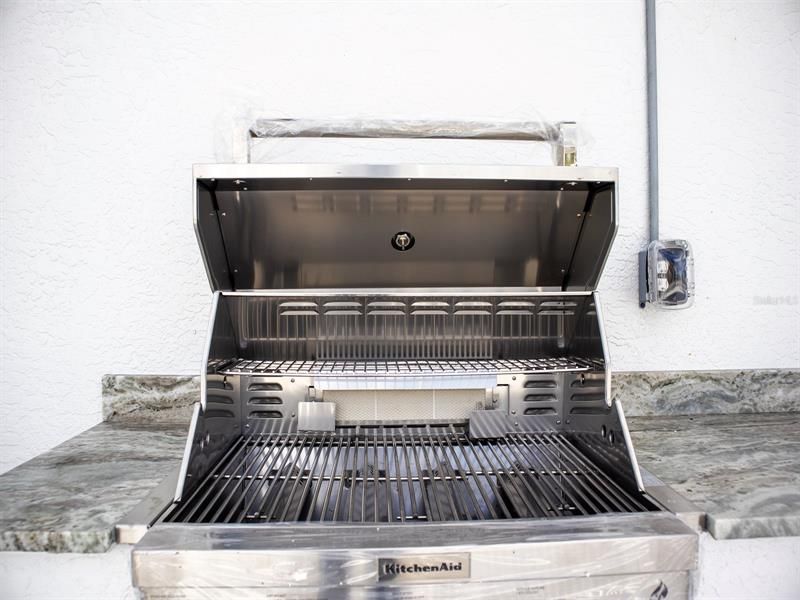 Brand new outdoor grill with beverage cooler