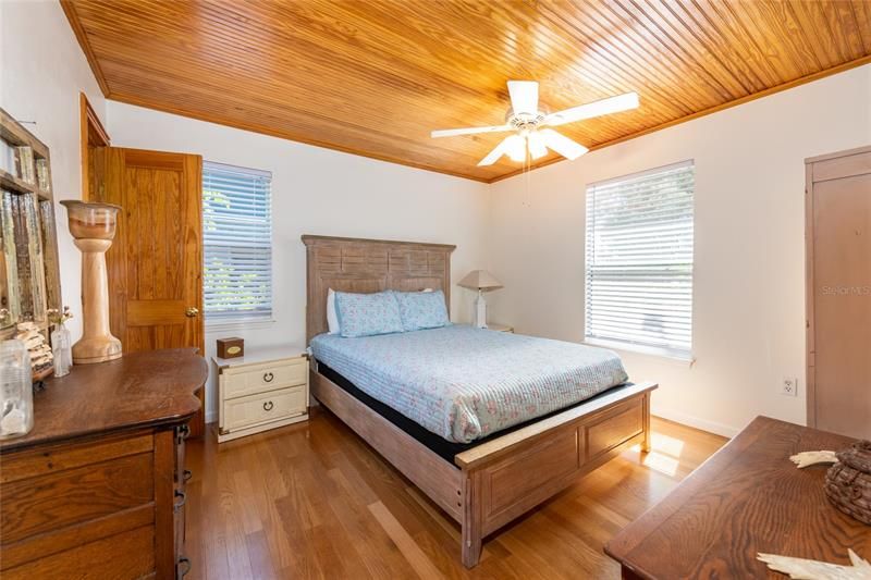 Master Bedroom with Hardwood Floors and shiplap ceilings