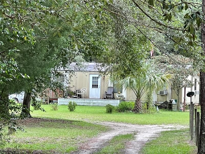 Looking down the driveway to the mobile Home.