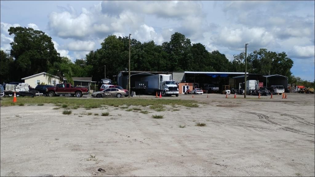 8 Truck service bays with A/C Office & Reception in the center - 3 rental Bedrooms on top of office