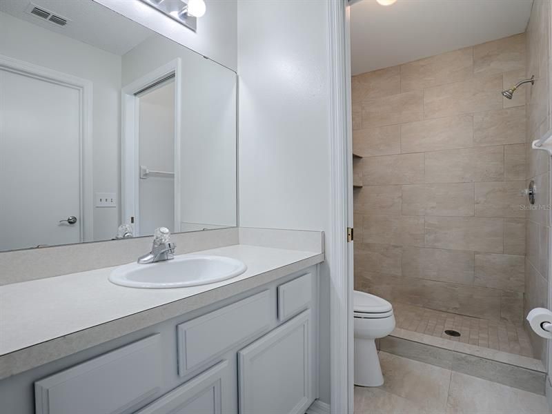 MASTER BATH AND SEPARATE COMMMODE WITH POCKET DOOR