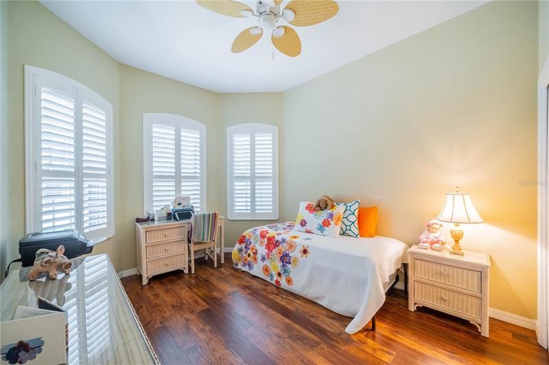 Guest bedroom with great view of plantation shutters