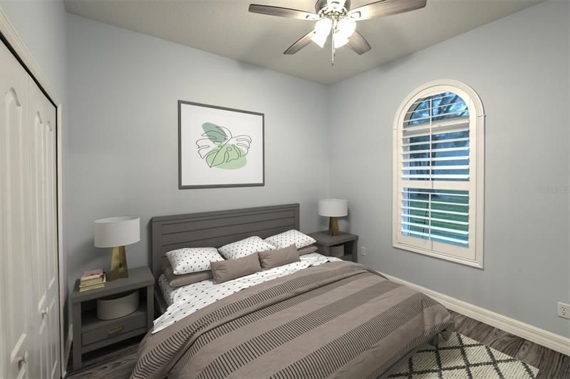 Guest bedroom with plantation shutters overlooking the backyard.