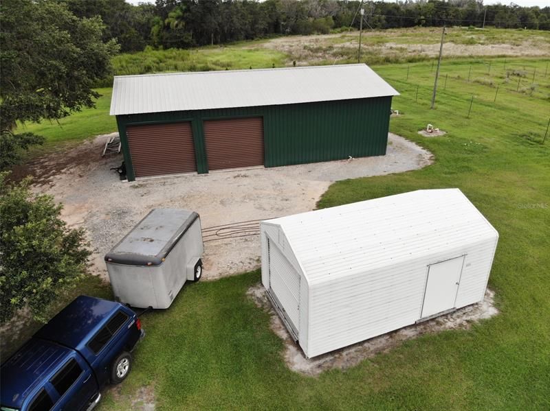 Storage shed and large metal building with side load doors
