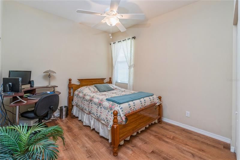 Bedroom # 3 with ceiling fan and engineered hardwood flooring