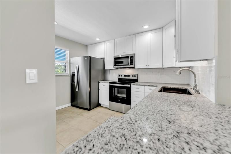 All new stainless steel appliances, cabinetry, sinks and countertops!