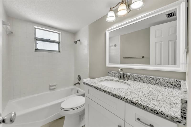 Beautifully updated second bathroom with soaking tub.