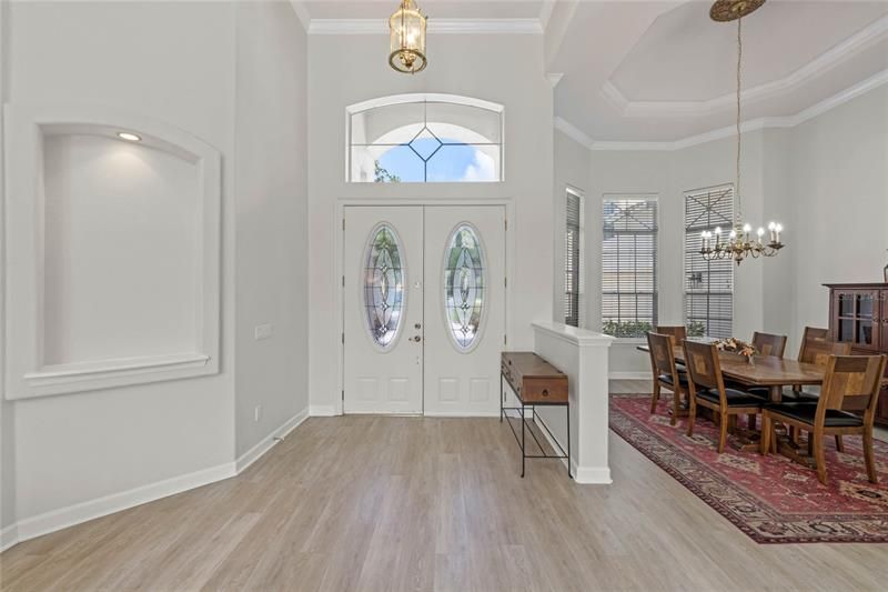 entry way with french doors and formal dining room