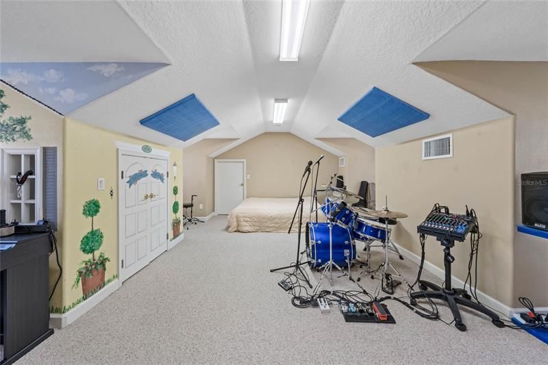 bonus room currently used as a music room.  full height ceiling