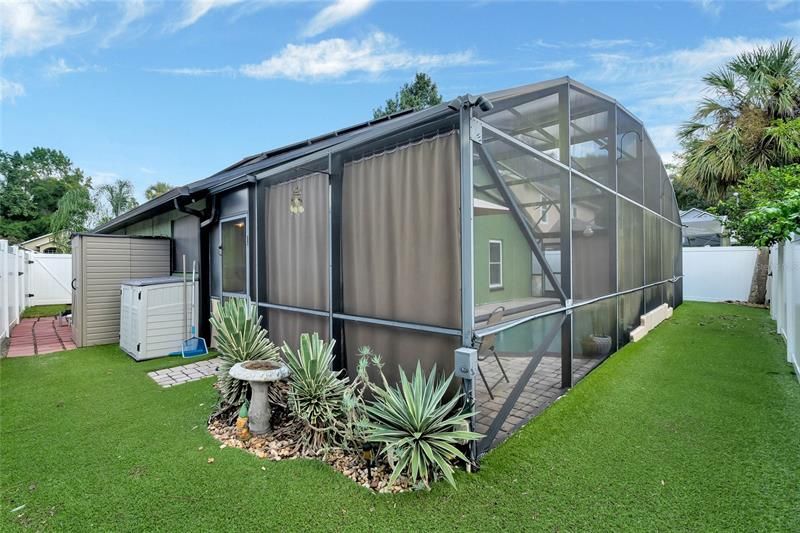 Sheds with surrounding porous artificial grass