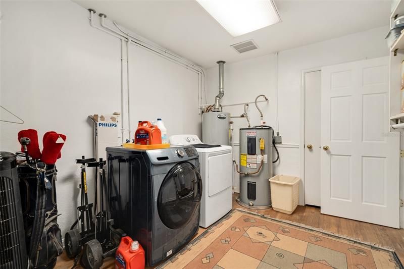 Large inside laundry and storage room..gas & electric water heaters