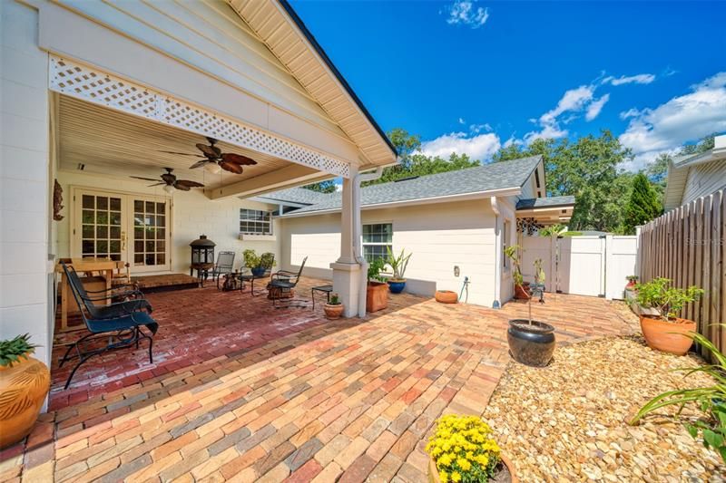Covered porch with large open patio off family room