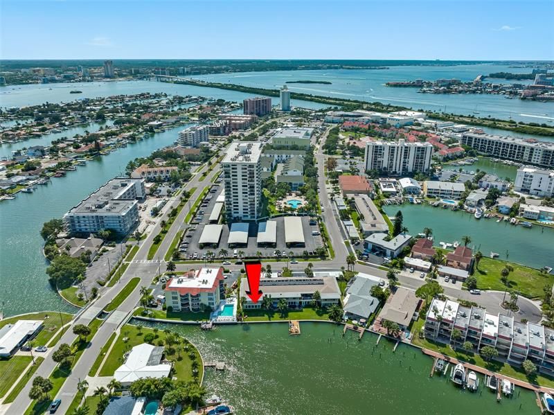 Arial view of beautiful, sunny, Island Estates in Clearwater Beach, Florida - the red arrow is pointing towards the back side of your unit A-5.