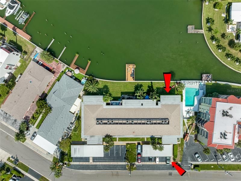 Arial shot of red arrows pointing at the front/rear view of Unit A-5 at 270 Skiff Point on beautiful, sunny, Island Estates in Clearwater Beach, Florida