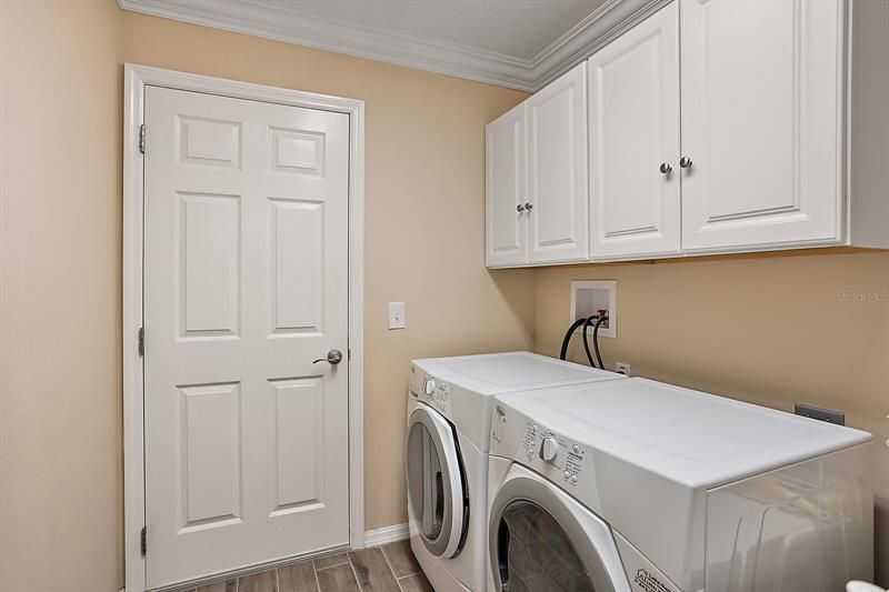 Inside laundry room w/extra cabinet space