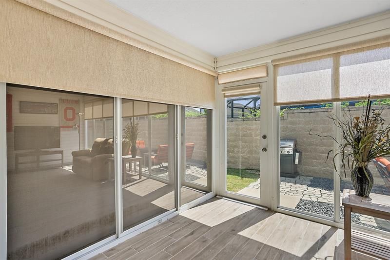 Glass enclosed lanai w/ access to private back patio