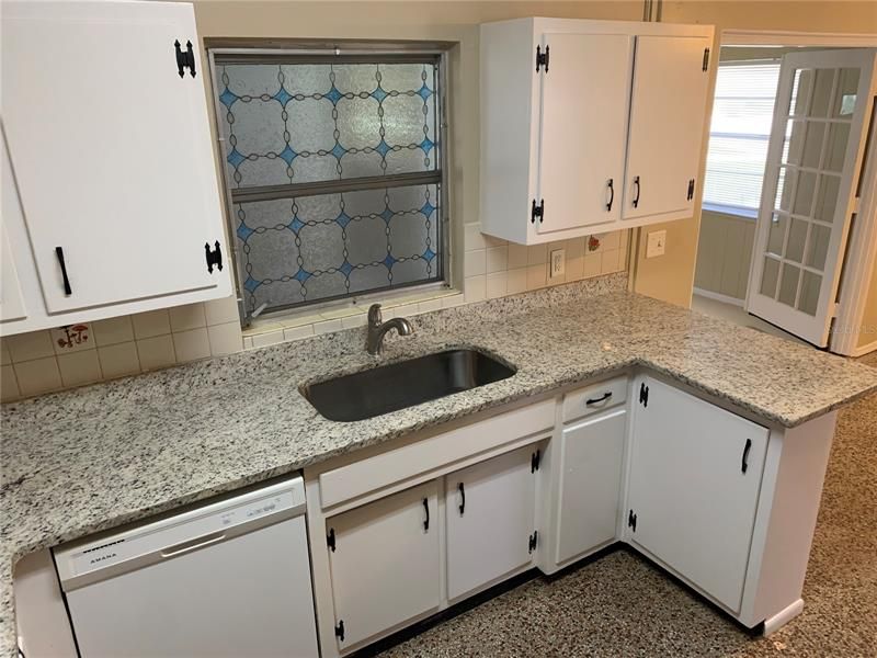 Main House Kitchen Oversized single bowl sink with granite tops