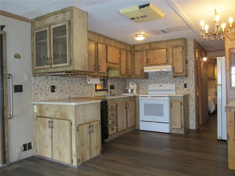 There are lots of cabinets in this very functional kitchen.