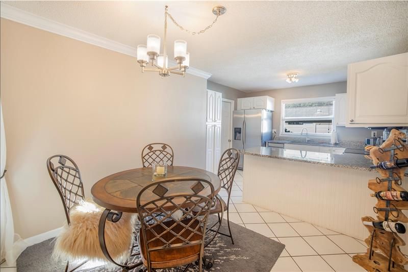 Dining opens up to updated kitchen with access to the garage and backyard!