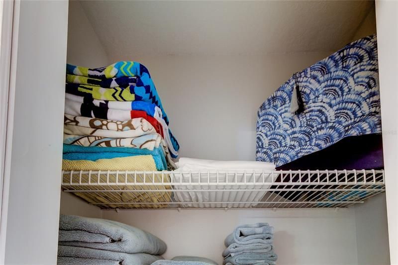 Hallway closet features extra towels...BEACH TOWLES.. Beach sheets.. And beach tote!