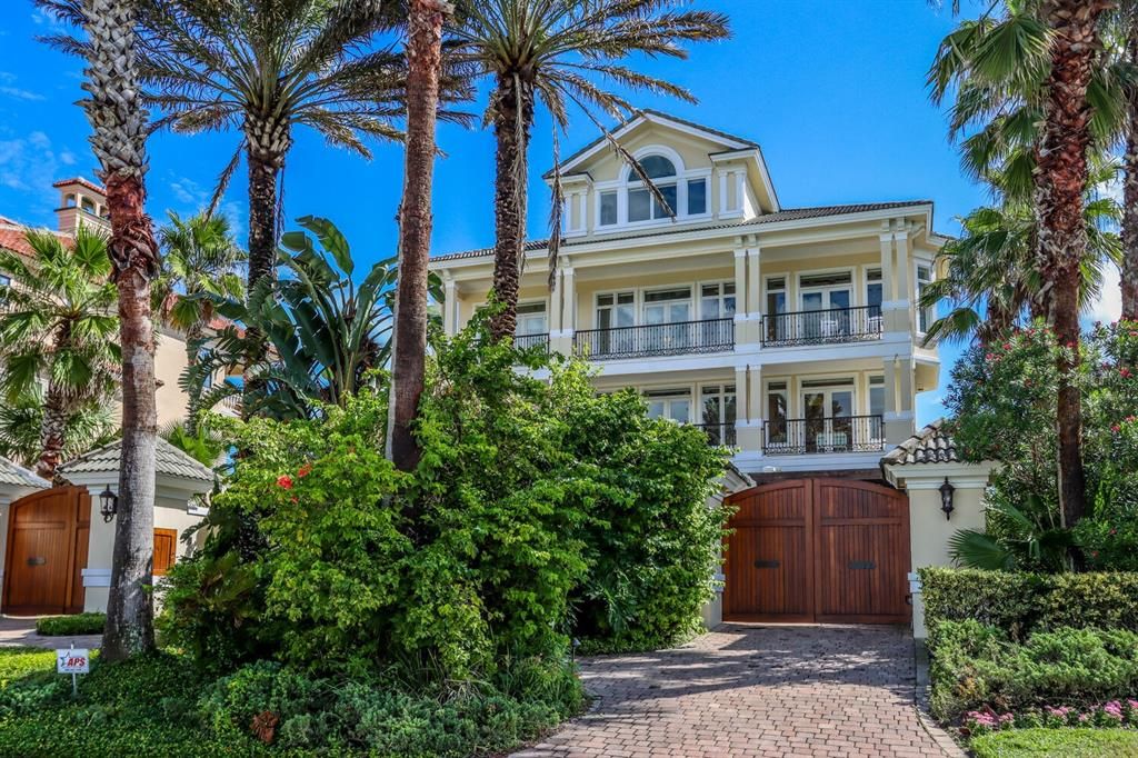 Gated entrance to this beautiful home with circular drive thru garage