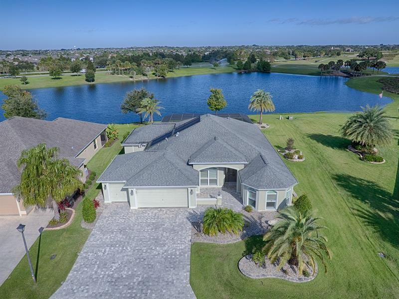 AERIAL VIEW OF THE HOME AND HUGE LAKE BEHIND.