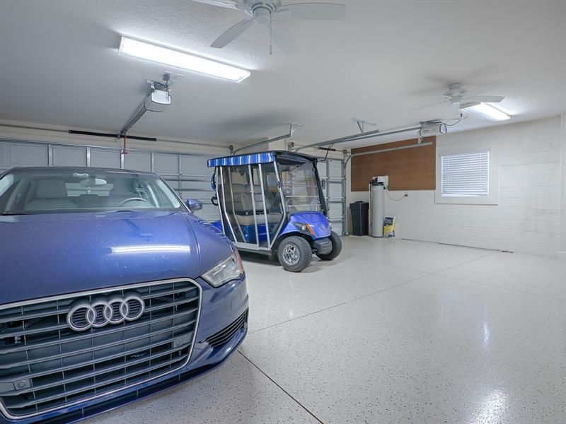 OVERSIZED 2-CAR + GOLF CART GARAGE WITH PLENTY OF ROOM FOR 2 CARS AND 2 GOLF CARTS.  PEGASUS WATER SOFTENER CONVEYS WITH THE HOME.
