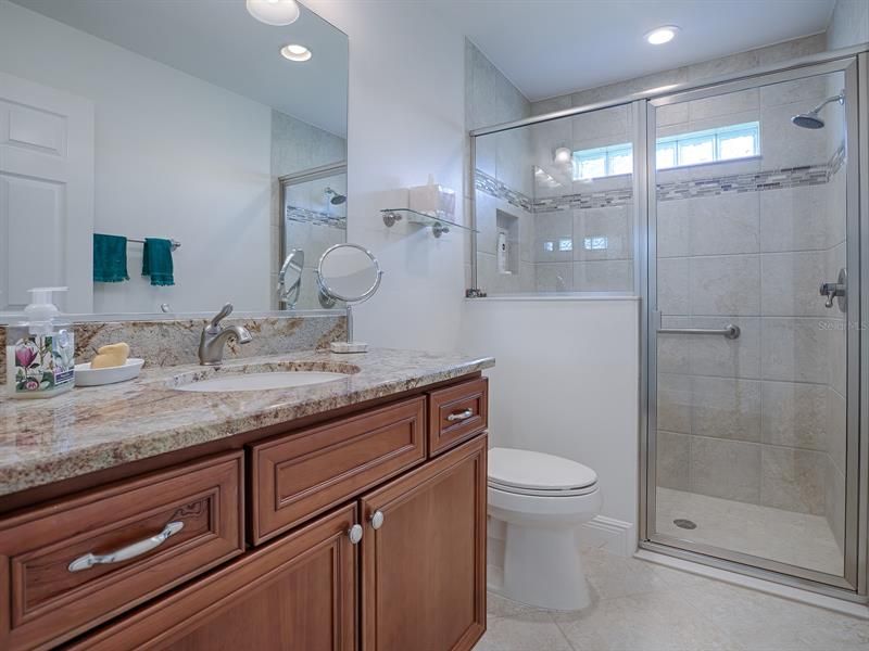 GUEST BATHROOM WITH GRANITE COUNTER TOPS, TILED SHOWER!