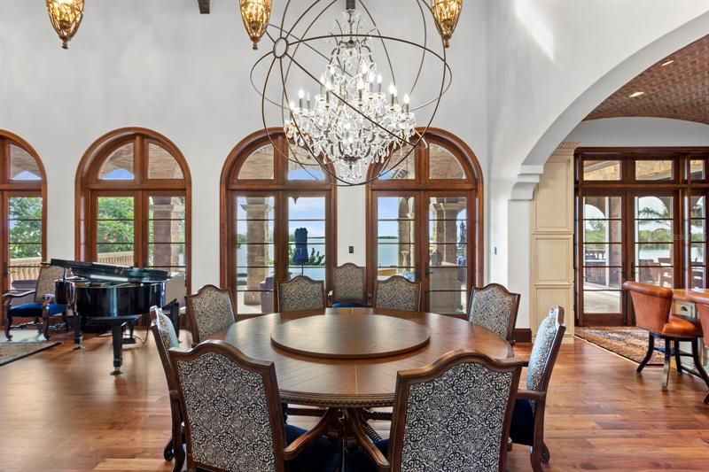 Enjoy indoor dining beneath this stunning Restoration Hardware light fixture!