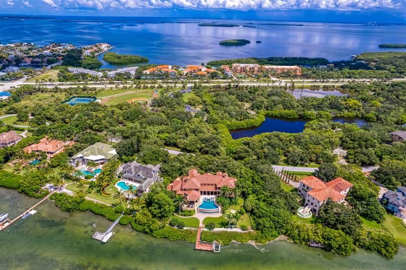 This aerial photo shows the expansive privacy with the lush landscaping of this truly magnificent estate