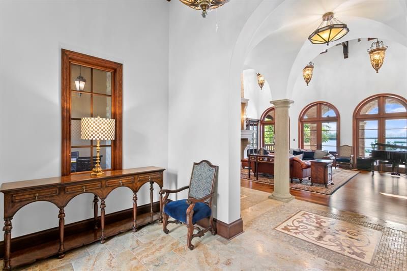 Once inside there is a stately foyer with intricate marble and tile flooring