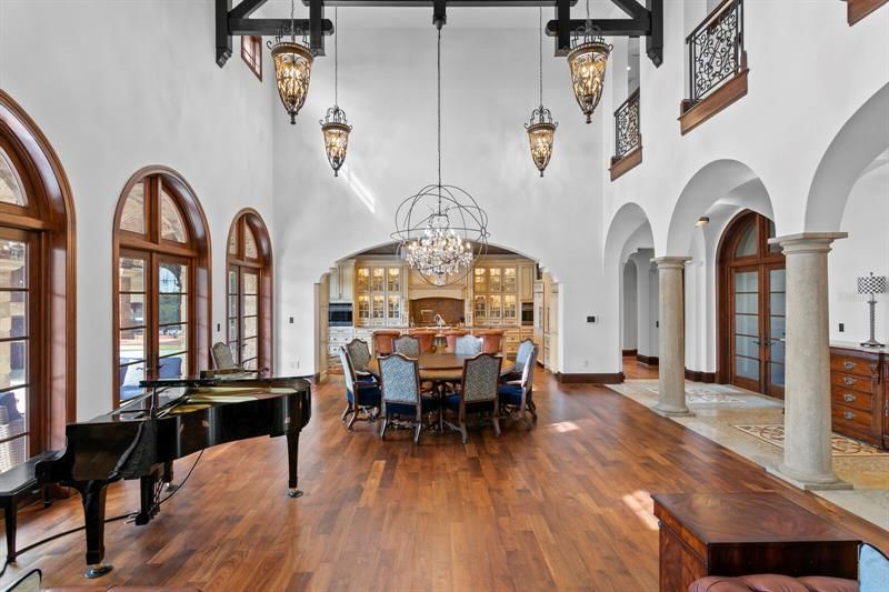 The approximate 25 foot high ceilings with ten stunning chandeliers make a statement to your guests when entering your home!