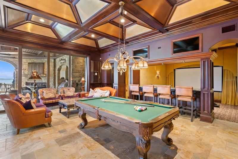 The focal pointe in this room is the billiards table and a huge 11'3" by 6'3" screen.  The technology is top of the line CRESTON. The cooper ceiling gives added interest