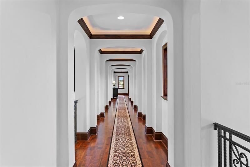 Second floor hallway leading to the gym and additional bedrooms