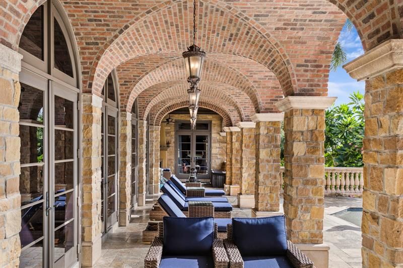 The loggia extending the length of the pool area is perfect for lounging in the afternoon sun.  The brick barrel cove ceiling is exquisite!