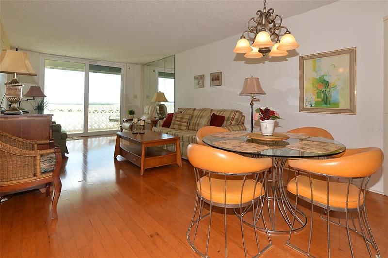 Check out the those pecan hardwood floors with the perfect dining room set for that beach life.