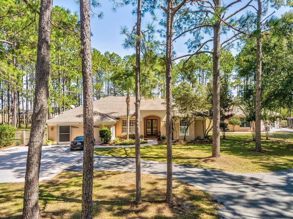 Drone Shot of the Front of the Main House w/ Guest House and Guest Driveway to the Right in the Distance