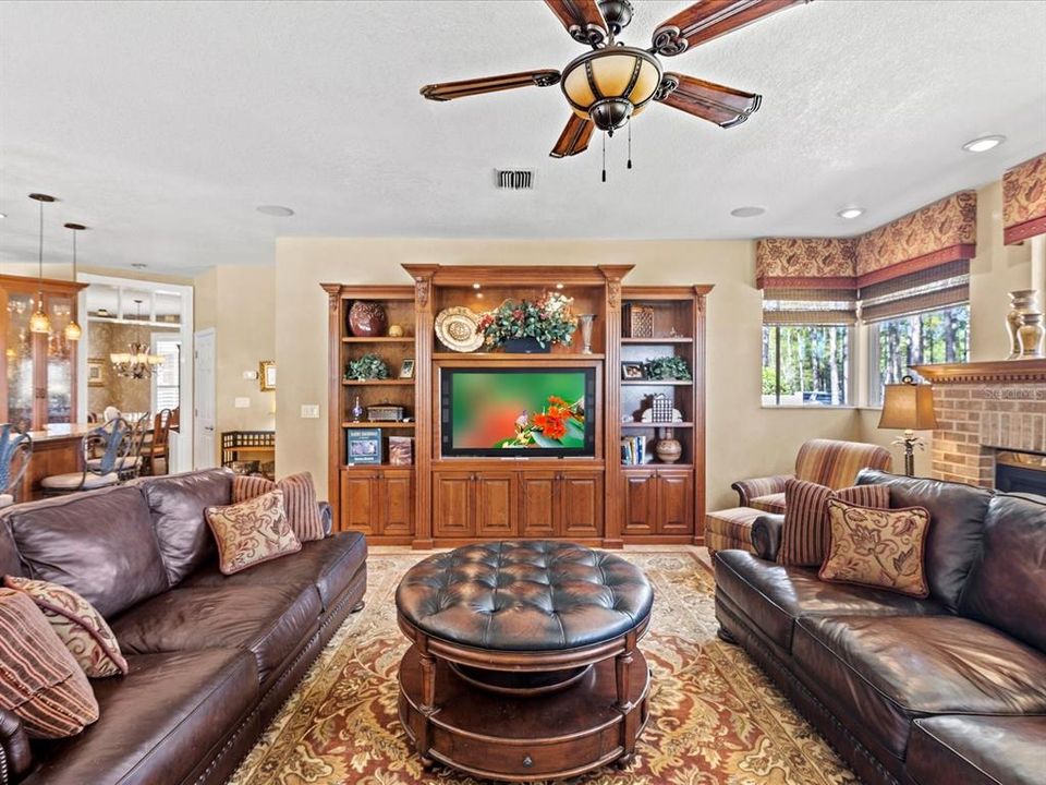 View of the Family Room w/ the Kitchen on the Left & Fireplace on the Right