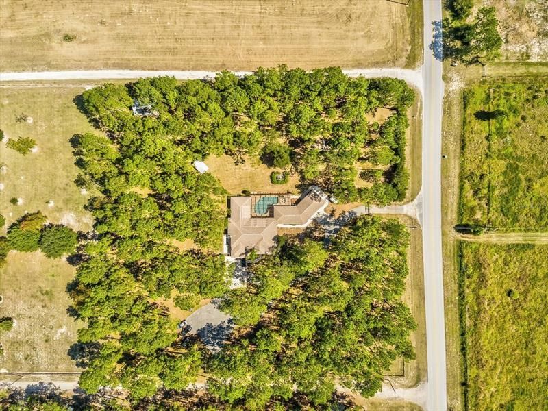 Drone Aerial View of the Property Which Shows the Side Gated Private Entrance & Driveway to the Guesthouse