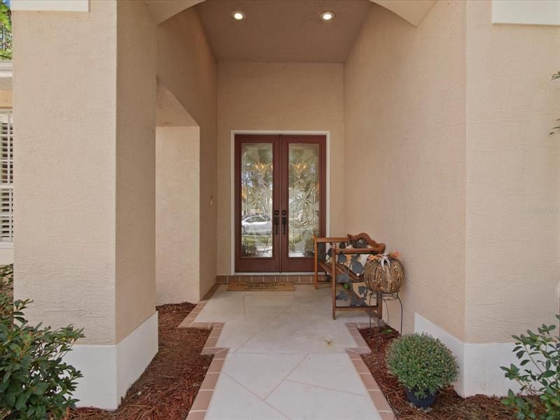 View of the Main House Front Porch Area Highlighting the Custom Etched Glass Double Front Doors