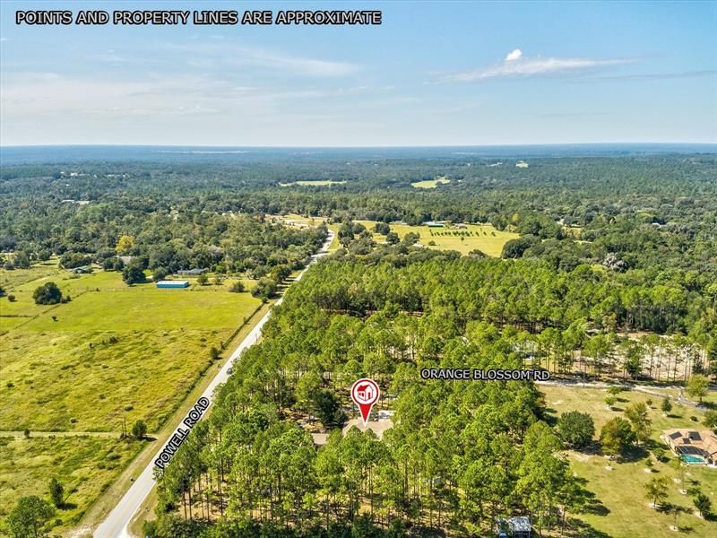 Another Drone Aerial View of the Property and Surrounding Area Looking West