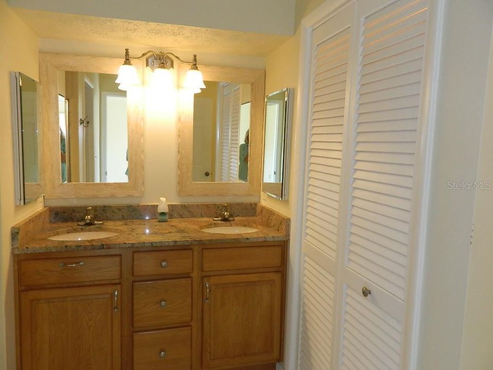 Master Bath dual sinks quartz counters and a linen closet