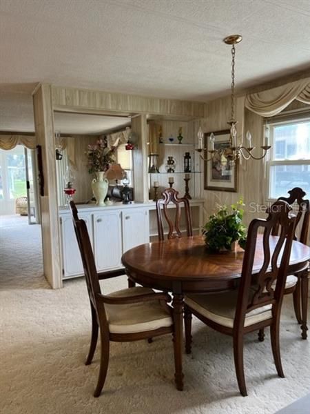 Dining Area overlooking Living Room and Built in Storage and Display area.