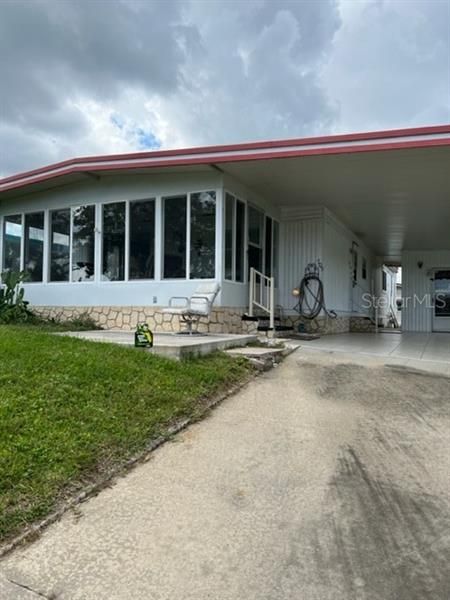 Florida room, open patio, breezeway and carport.